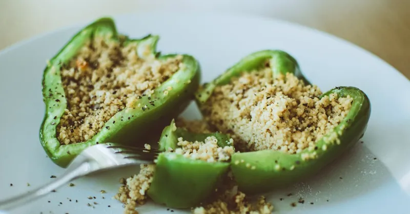Delicious stuffed green bell pepper with couscous, perfect for a healthy vegetarian meal.