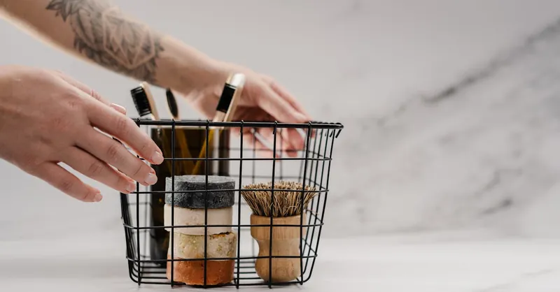 Discover zero waste bathroom essentials in a wire basket for eco-friendly living.