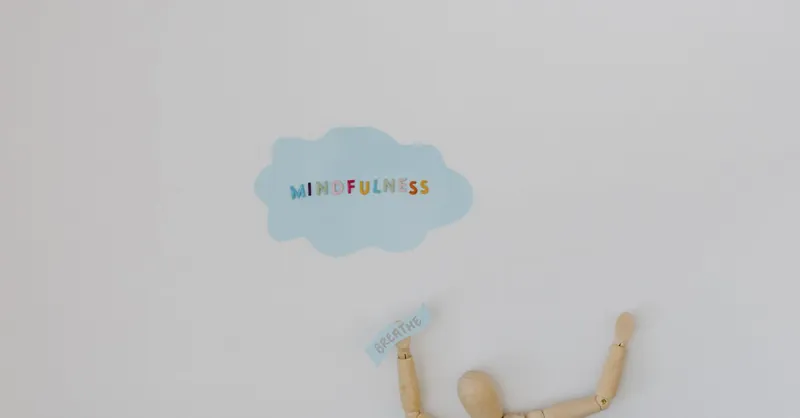 Wooden figure promoting mindfulness and breathing on a clean white background.