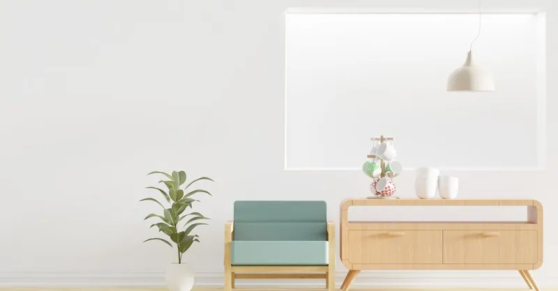 Minimalist living room featuring modern furniture, a wooden dresser, and green plant.