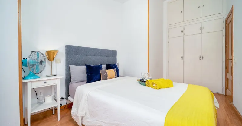 A stylish minimalist bedroom featuring modern design, perfect for home inspiration.