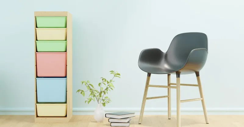 Modern minimalist interior featuring a stylish chair and a colorful storage unit.