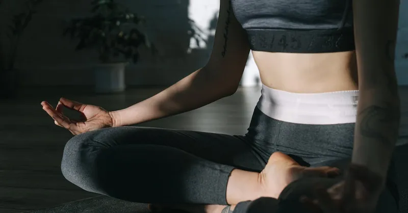 A serene yoga session indoors highlighting peaceful meditation and wellness.