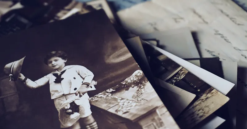A nostalgic close-up of vintage photos and letters revealing memories from the past.